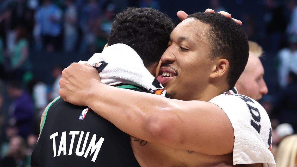 Boston Celtics forward Jayson Tatum, left and Charlotte Hornets forward Grant Williams, right, hug one another following the team’s game at Spectrum Center in Charlotte, NC on Monday, April 1, 2024. The Celtics defeated the Hornets 118-104.