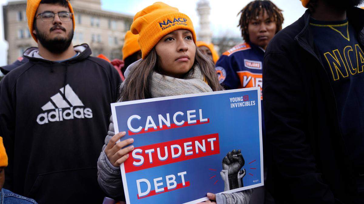 Student debt relief advocates gather outside the Supreme Court on Capitol Hill in Washington, Tuesday, Feb. 28, 2023.. Arguments at the Supreme Court over President Joe Biden’s student debt cancellation left some borrowers feeling isolated as they heard such a personal subject reduced to cold legal language.