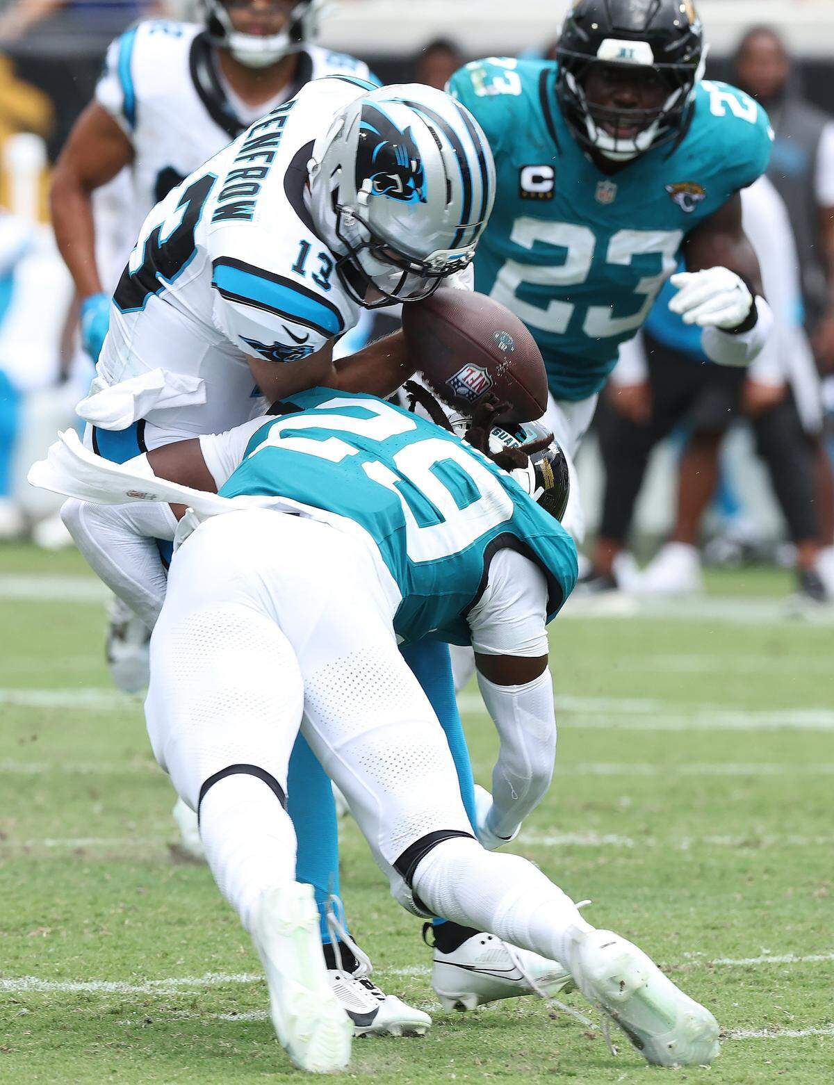 Carolina Panthers wide receiver Hunter Refrow, left, is unable to maintain control of the ball as Jacksonville Jaguars safety Eric Murray, right, makes the hit during action on Sunday, September 7, 2025, at Everbank Stadium in Jacksonville, Florida.