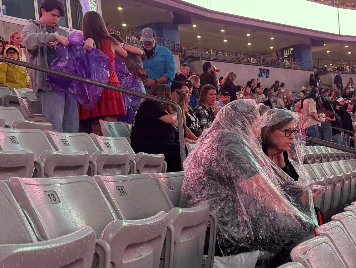 Fans return to their seats at Concert for Carolina after Bank of America Stadium was evacuated briefly due to inclement weather on Saturday, Oct. 26, 2024.