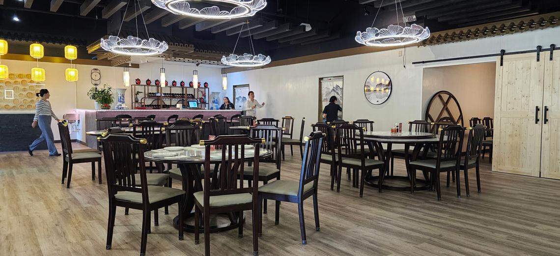 Modern chandeliers light the dining room at The Imperial Treasure.
