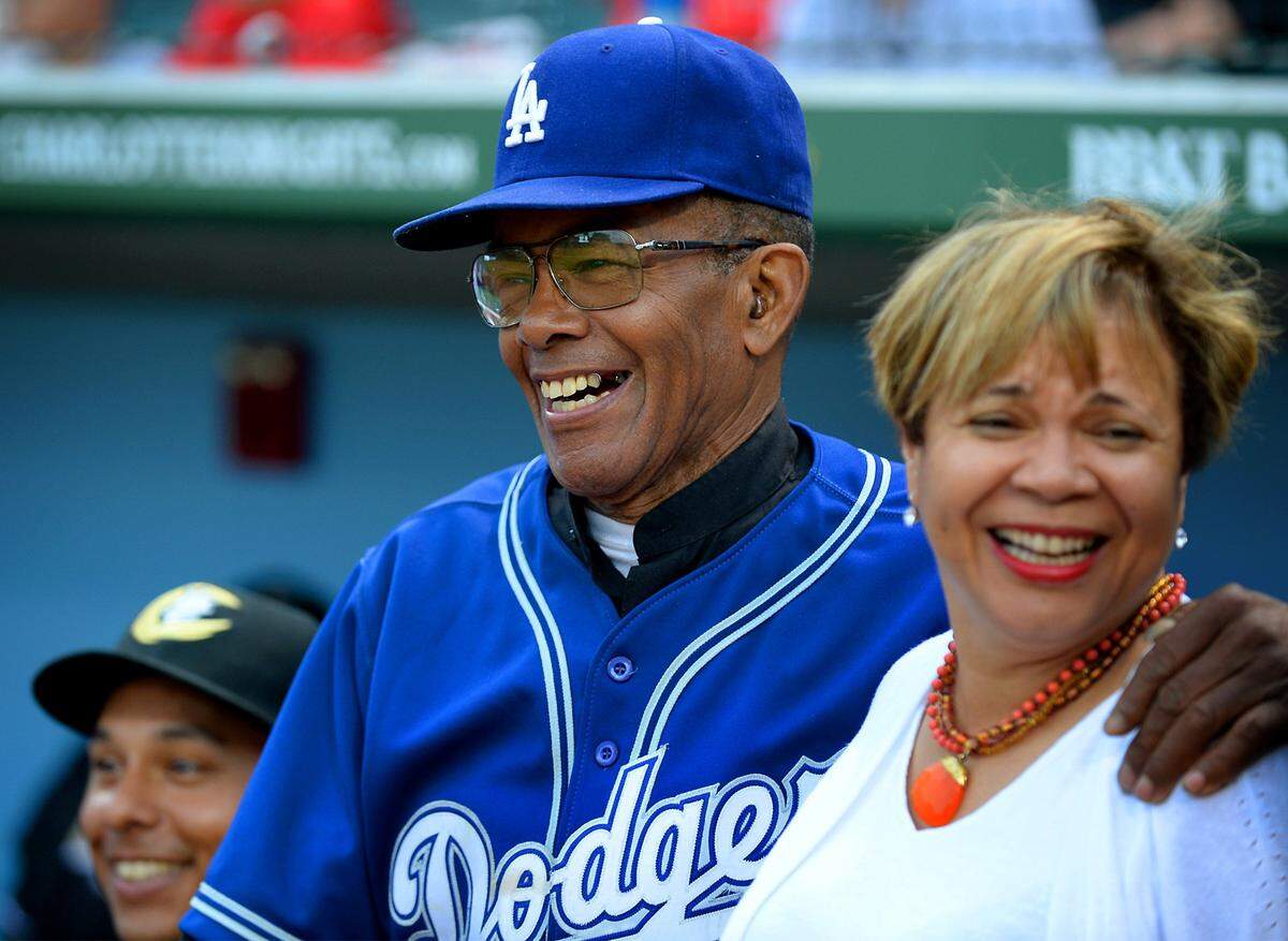 Former Negro League player Bill Cathcart, left, jokes with Charlotte Mayor Pro Tem Vi Lyles at BB&T BallPark prior to the Charlotte Knights vs Pawtucket Red Sox game on Tuesday, April 18, 2017. The Charlotte Knights celebrated Negro League Baseball Night at BB&T BallPark. The players, manager and coaches all wore number 42 in honor of Jackie Robinson, who broke the color barrier 70 years ago with the Brooklyn Dodgers.