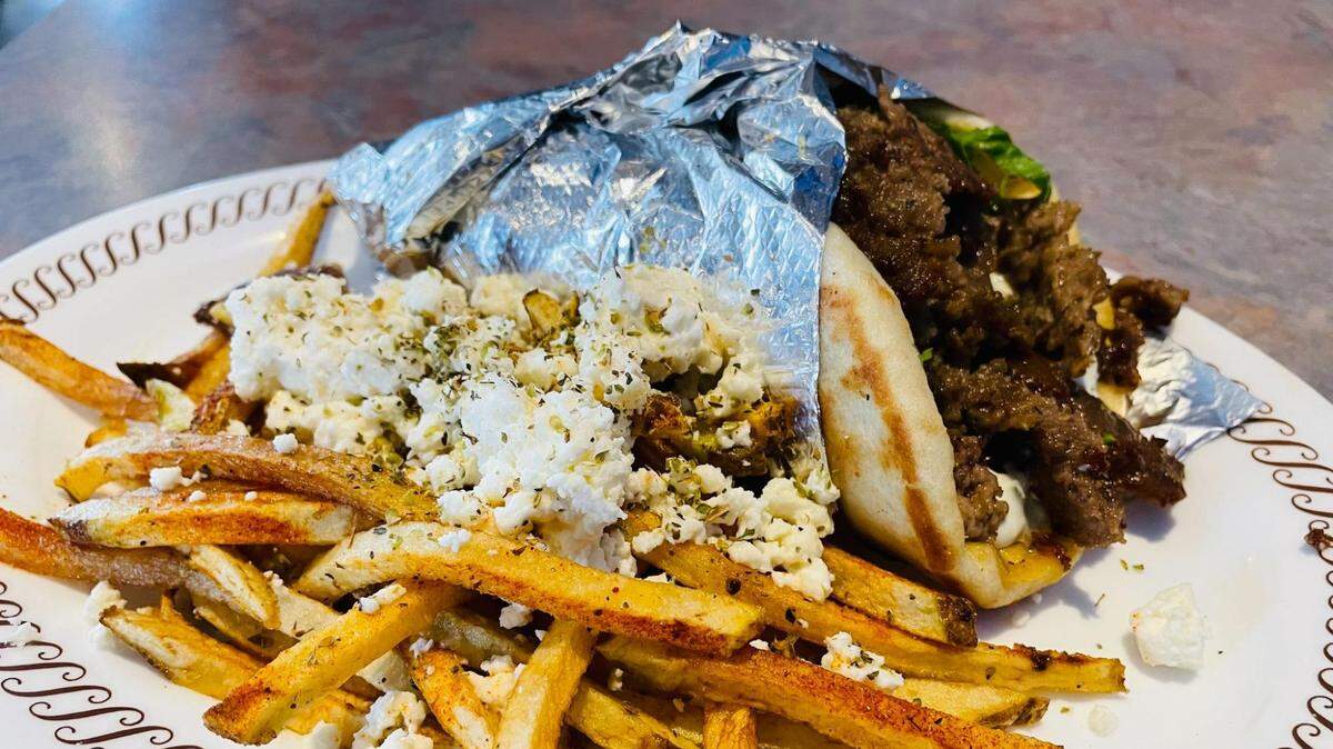 Order a gyro and feta fries from The Mad Greek of Charlotte.