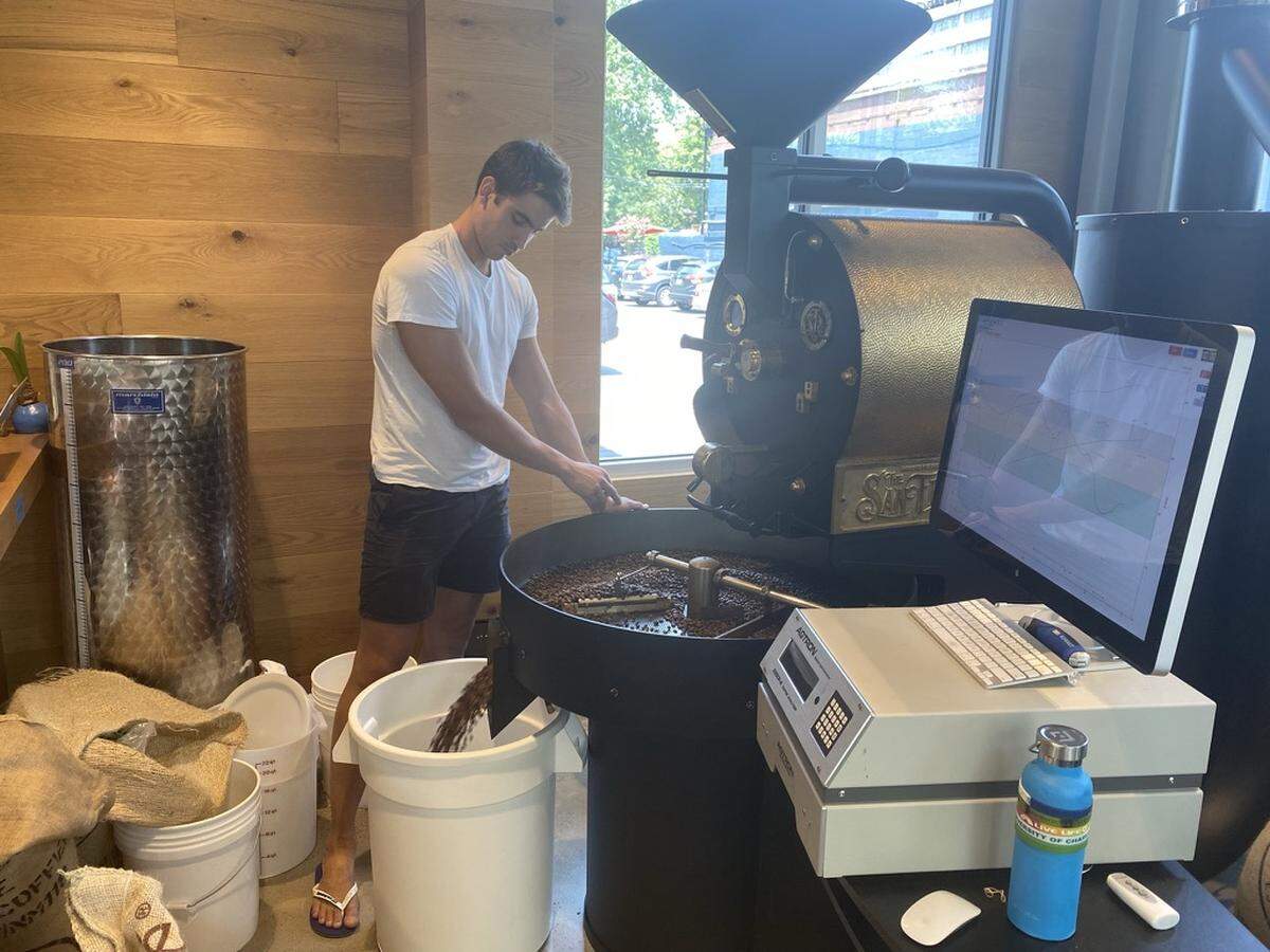 The Giddy Goat’s Enzo Pazos roasts a fresh batch of coffee beans.