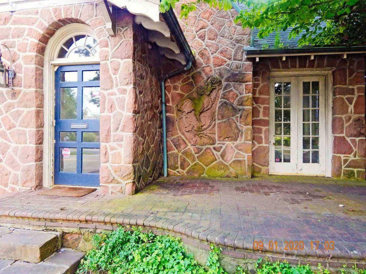 A griffin has adorned the brownstone of this home on Crescent Avenue in Charlotte since 1925, when the home was built in the Colonial Heights neighborhood by developer Oscar Thies.