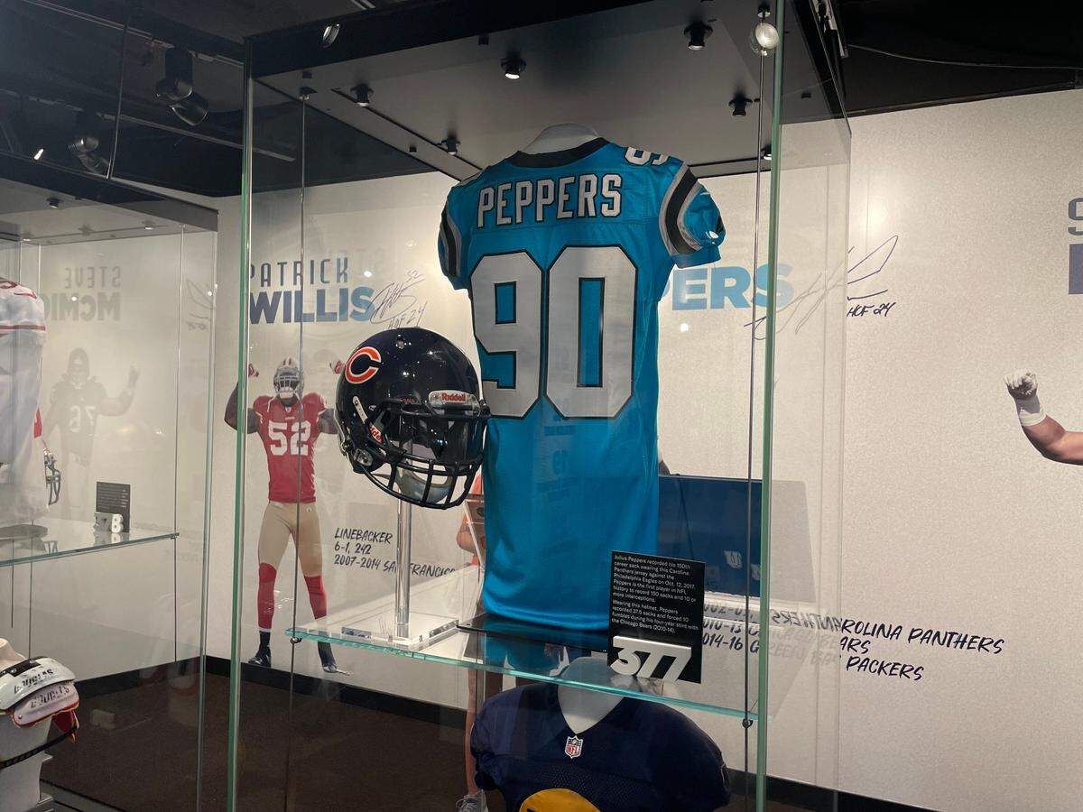 The Julius Peppers exhibit sits in the welcome center of the Pro Football Hall of Fame museum, alongside the rest of the Class of 2024, as of August 2024.