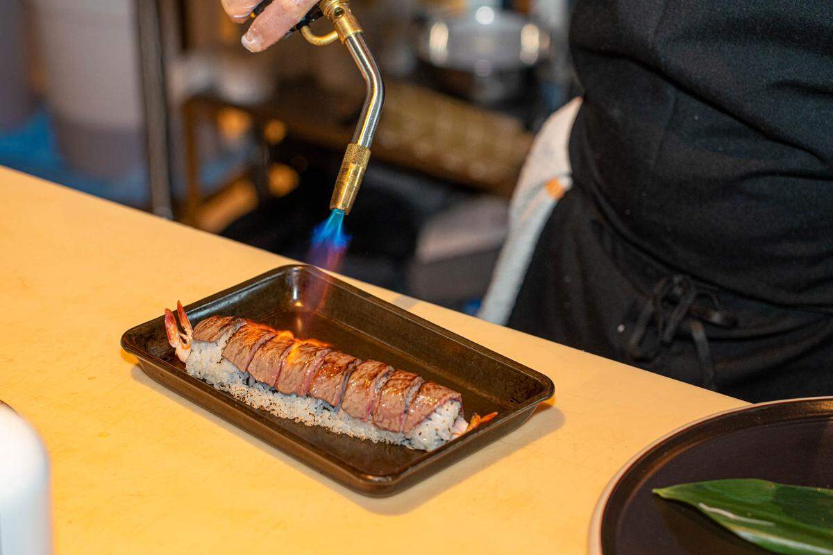 The Hestia Roll at Hestia Rooftop is torched with truffle oil.