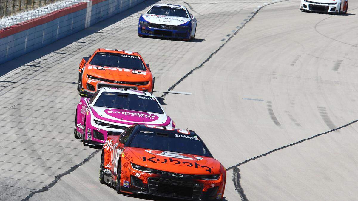Apr 14, 2024; Fort Worth, Texas, USA; NASCAR Cup Series driver Daniel Suarez (99) leads driver Zane Smith (71) and driver Chase Elliott (9) during the NASCAR Cup Series AutoTrader EchoPark 400 at Texas Motor Speedway.