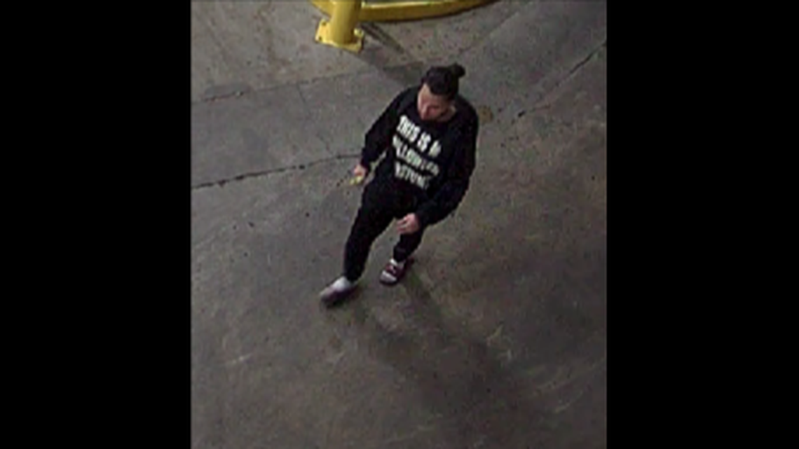 Photos have been released of a “person of interest” in the May 30 mortar attack in uptown Charlotte that left one police officer with second degree burns after his clothing caught on fire