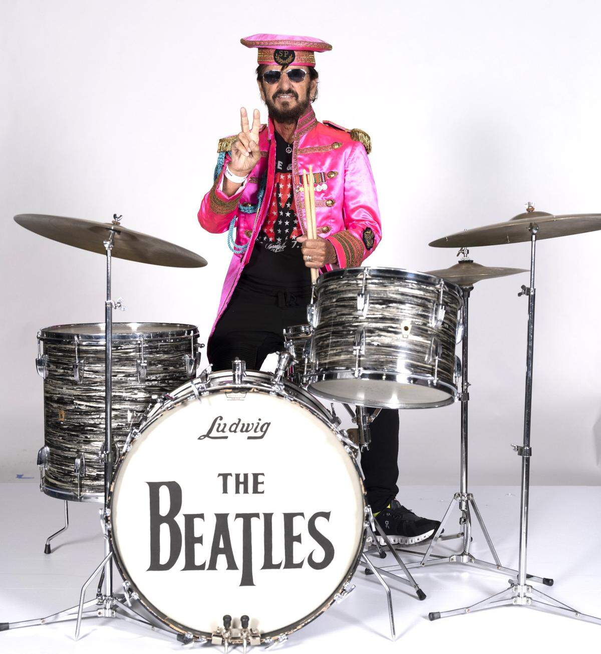 Ringo Starr was still able to fit into his old Sgt. Pepper outfit, and is never far from those equally iconic Ludwig drums.