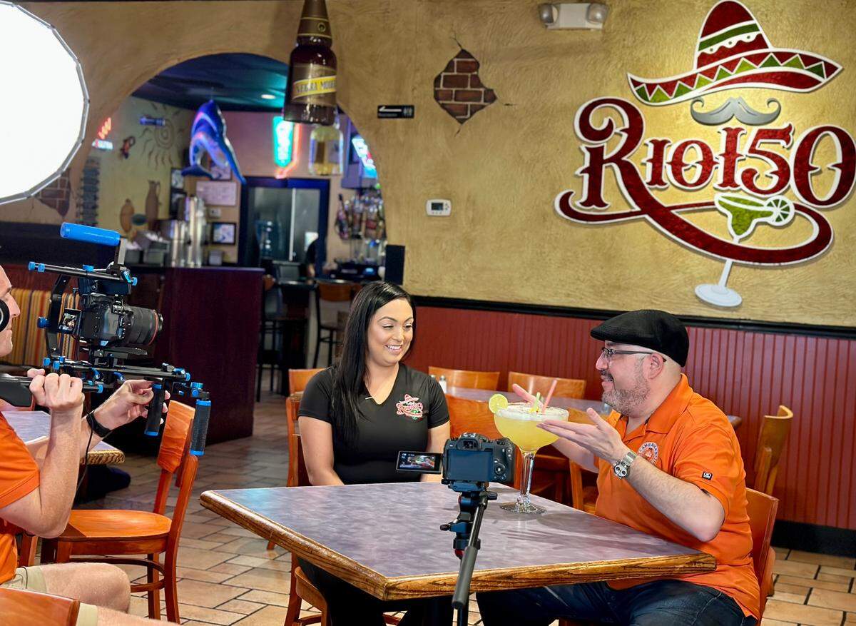 Rio 150 co-owner Rashel Limper with Luis Rivera, host of “America’s Best Restaurants”.