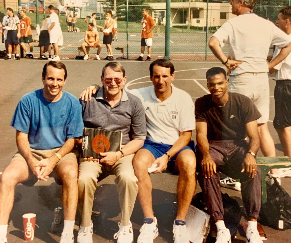 High school recruiting expert Bob Gibbons (second from left) poses at a basketball camp with the then-Duke basketball staff. Mike Brey is at the far left, head coach Mike Krzyzewski is second from right and Tommy Amaker is at the far right.