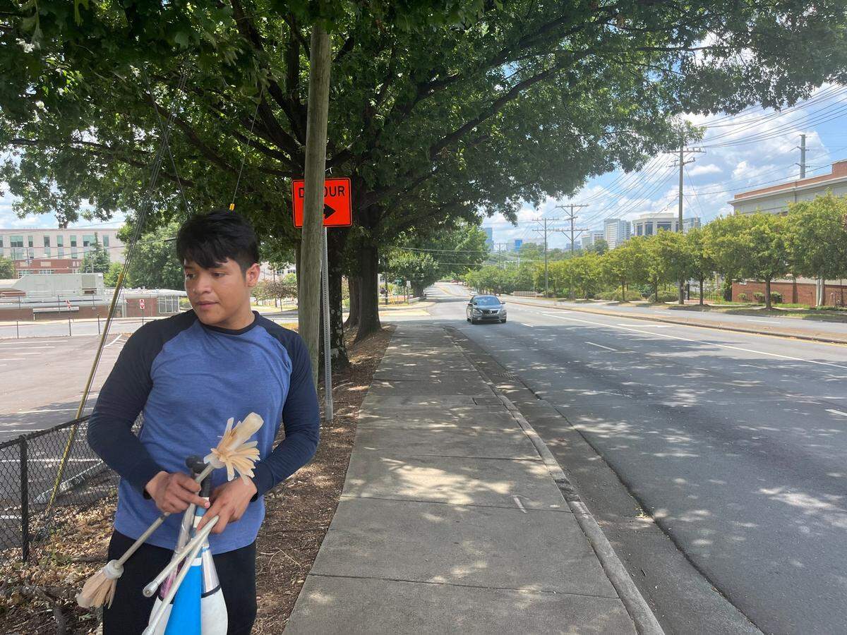 Erick Valentin, a landscaper, stands near North Kings Drive near uptown on July Fourth, where he and his roommate juggled at the intersection with East 7th Street when motorists stopped at red lights.