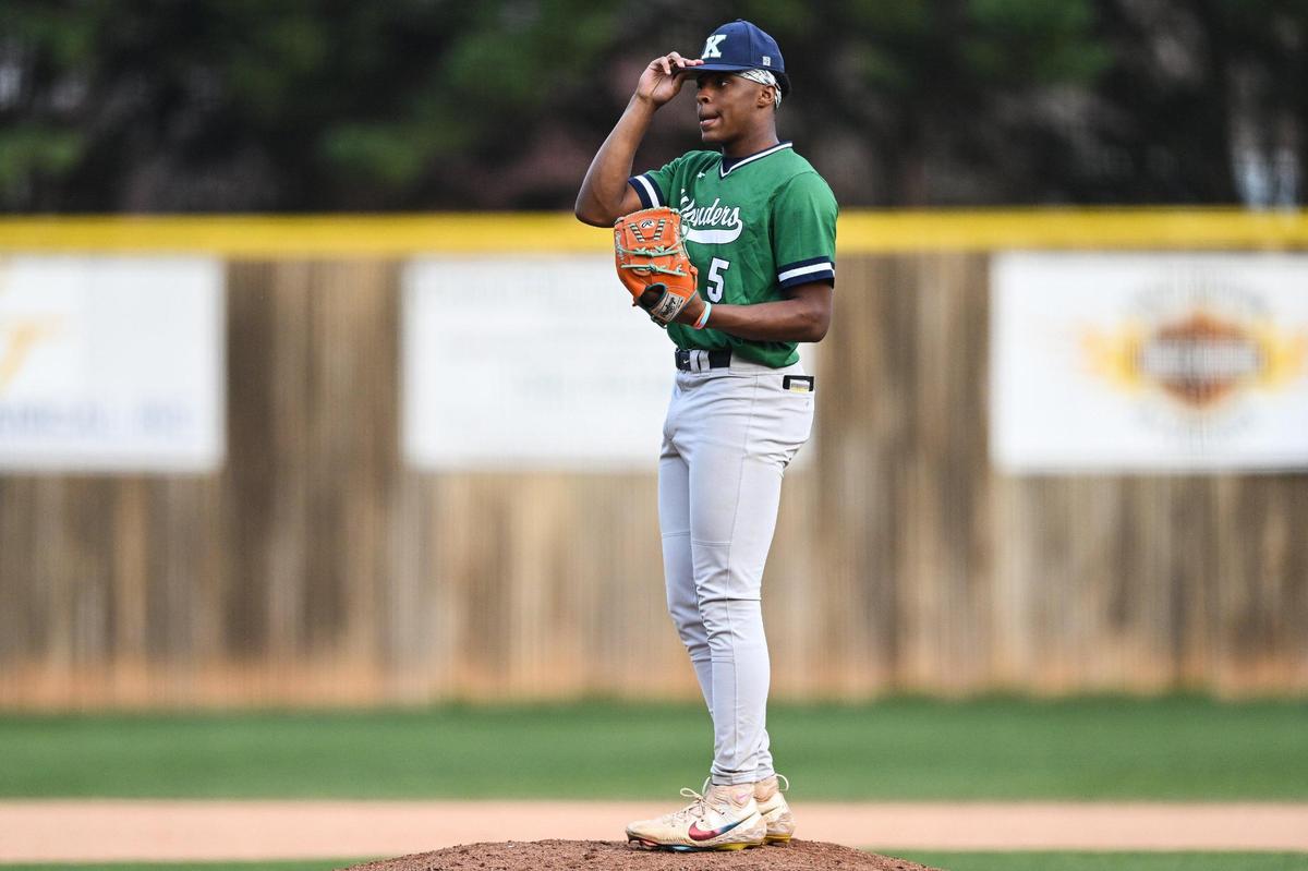 A.L. Brown pitcher C.J. Gray (5) tips his cap during a varsity baseball game against East Mecklenburg, Thursday, March 13, 2024, in Charlotte, N.C. (Charlotte Observer/Matt Kelley)