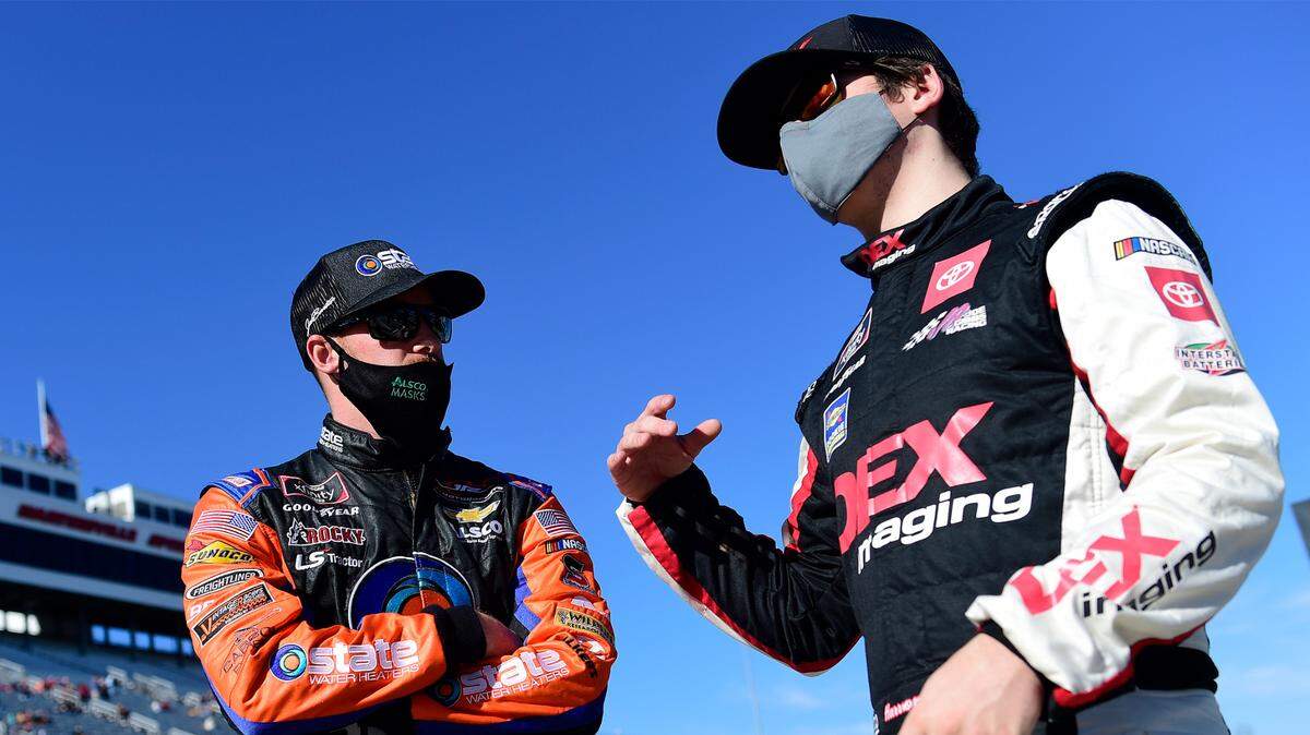 Cousins Jeb Burton and Harrison Burton talk on the grid prior to the NASCAR Xfinity Series Draft Top 250 at Martinsville Speedway on October 31, 2020 in Martinsville, Va.