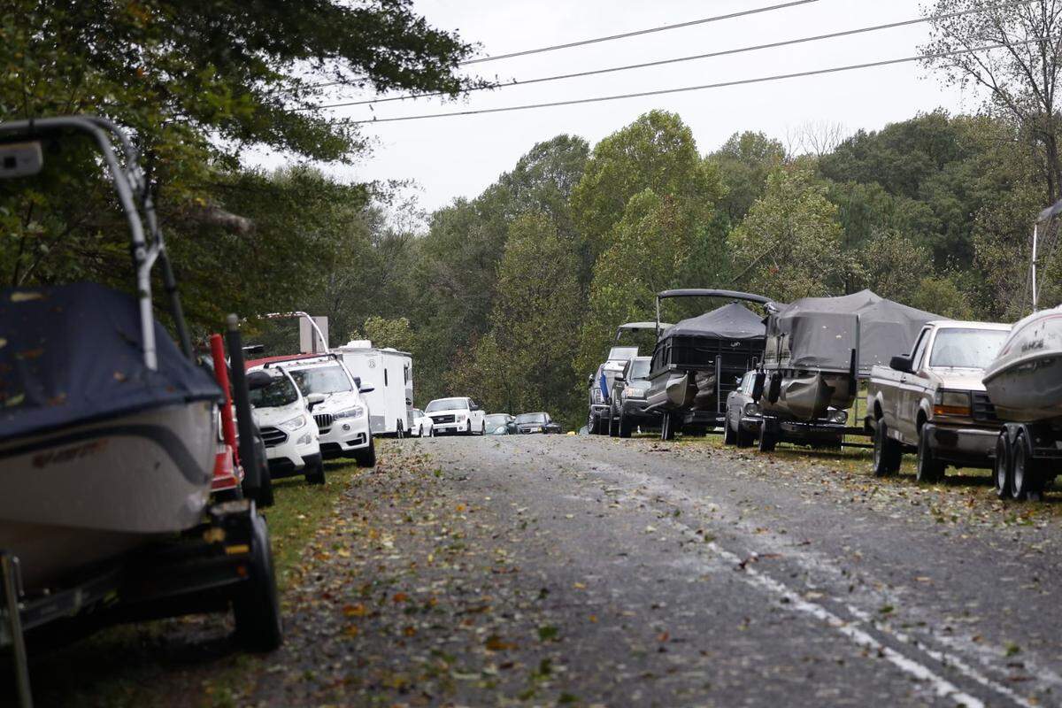 Cars and boats line Riverside Drive on Friday morning Sept. 27, 2024, as Helene moved across North Carolina.