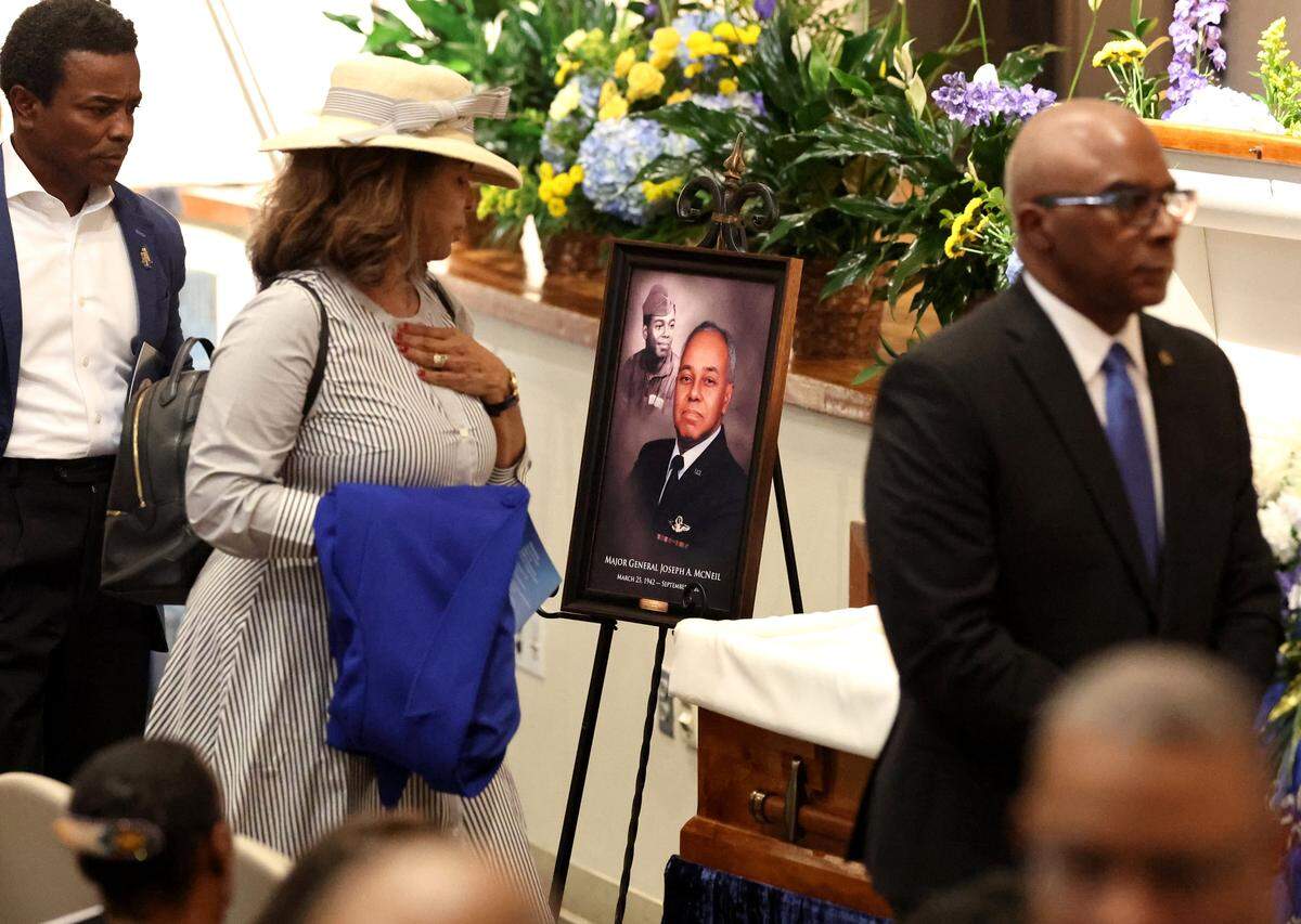 Mourners pass by the casket for Maj. Gen. Joseph McNeil during a memorial service at North Carolina A&T State University in Greensboro on Thursday, September 11, 2025.
