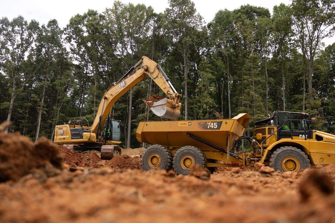 A construction crew works on the East West Connector in Mooresville, N.C., on Friday, September 13, 2024. Two years from completion, the connector has already attracted major housing subdivisions and a planned mega mixed-used community.
