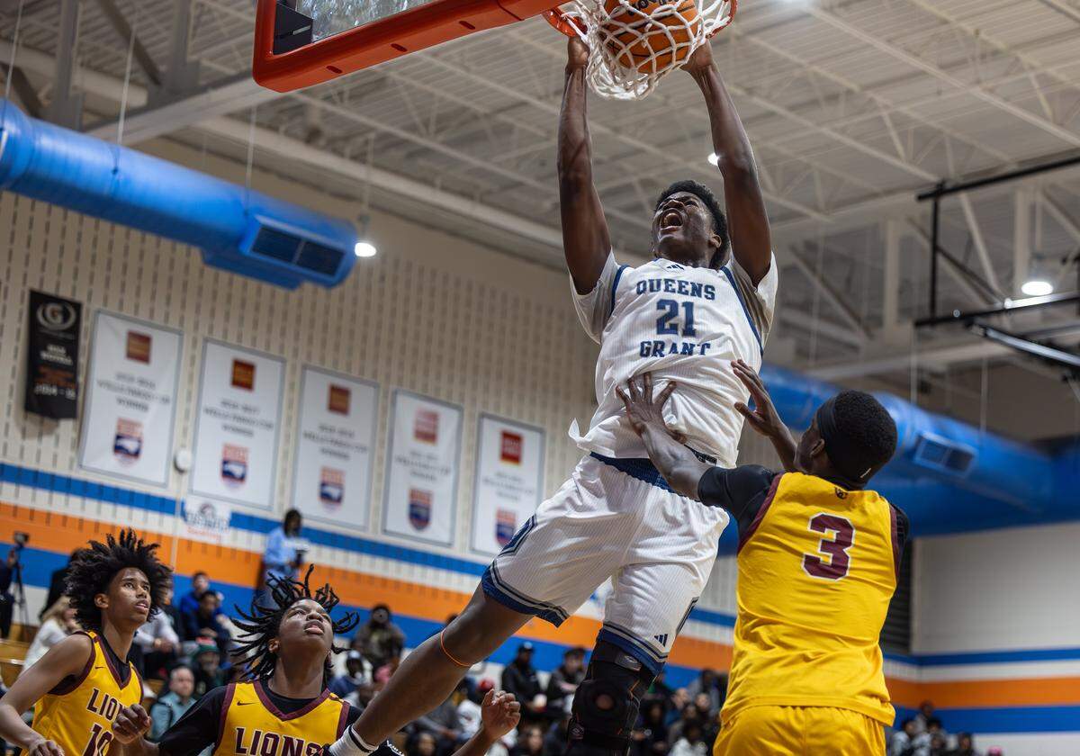 Queen’s Grant Stallions player Chase Smith dunks against the West Charlotte Lions during the Mike Gminski Classic at Marvin Ridge High School on Dec. 29, 2025, in Waxhaw.
