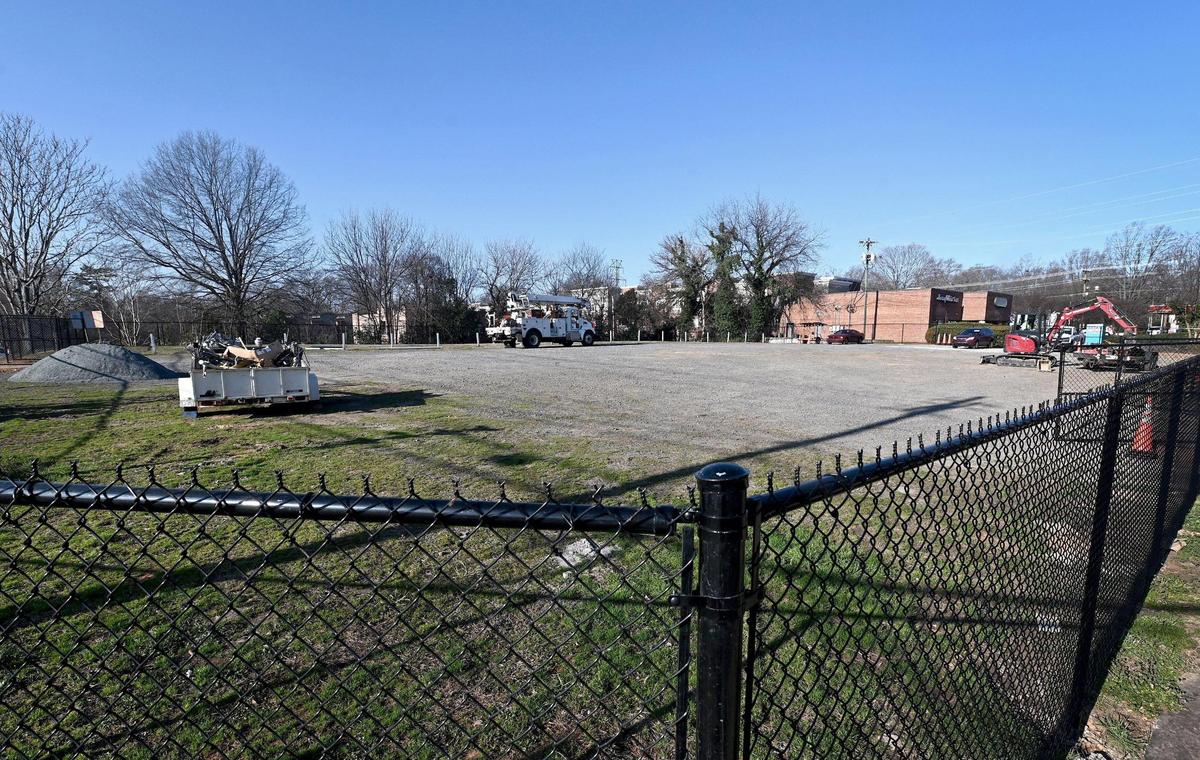 A fence has been placed around the old Epicurean Restaurant property at 1324 East Blvd. in Charlotte. The building was demolished in the 1990s. A developer is making plans to build apartments or office spaces on the property.