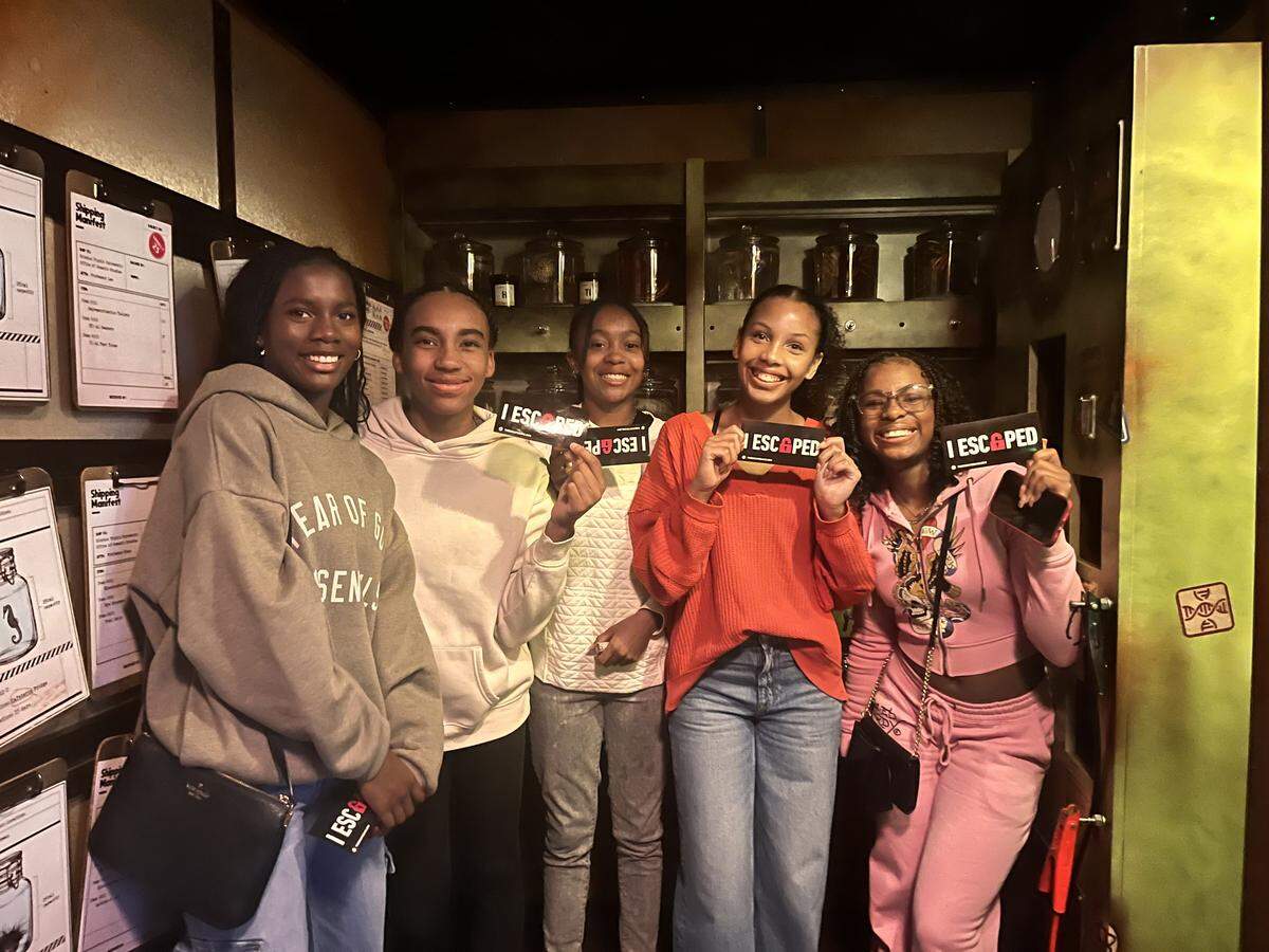 From left: Christina Hall, Mylan Clay, Sakeenah Odom-Pollard, Kaylee Dobbins and Zhoe Holt pose for a group photo after tackling an escape room together.