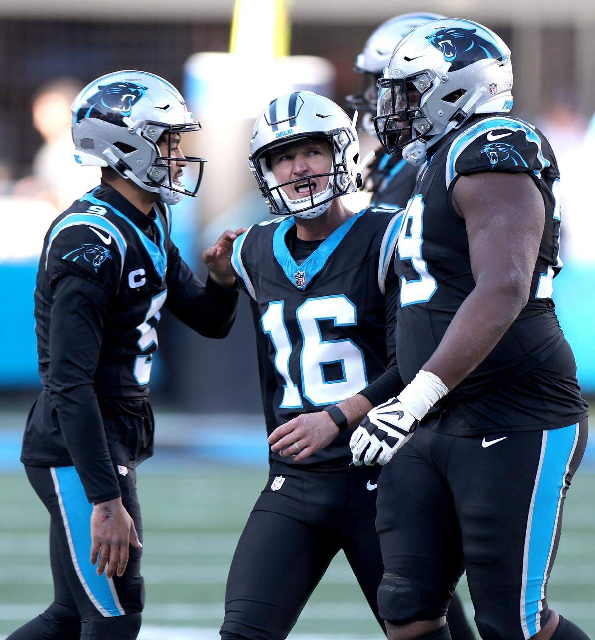 Carolina Panthers kicker Matthew Wright, center, is consoled by quarterback Bryce Young, left, and his teammates after missing a field goal attempt against the Tampa Bay Buccaneers at Bank of America Stadium in Charlotte, NC on Sunday, January 7, 2024. The Buccaneers defeated the Panthers 9-0.