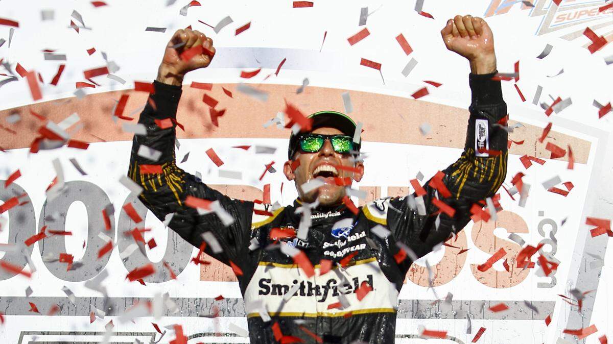 Aric Almirola celebrates in Victory Lane after winning the NASCAR Cup Series’  1000Bulbs.com at Talladega Superspeedway this month.