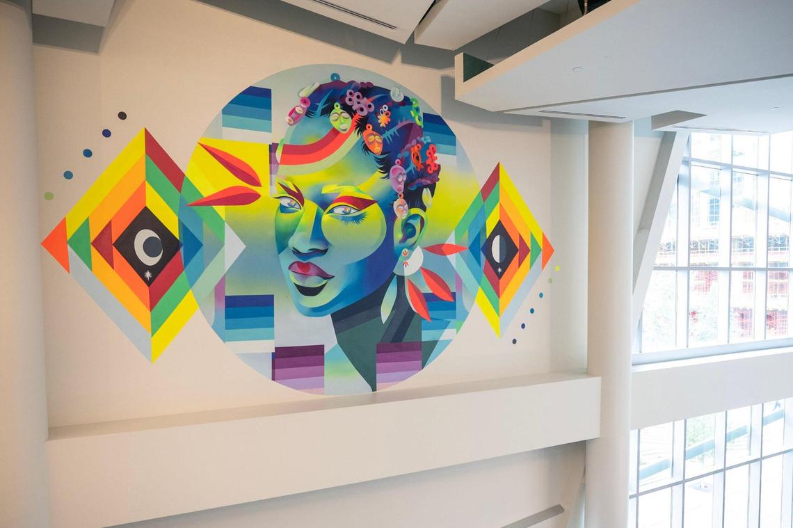 Local muralist and artist Georgie Nakima was recently commissioned to create a large-scale mural, titled “Earth Keeper”, within the Harvey B. Gantt Center for African-American Arts + Culture. “Creating this project at the Harvey B. Gantt Center is a full circle moment moment for me, being an artist based in Charlotte and growing up in Charlotte,” says Nakima.