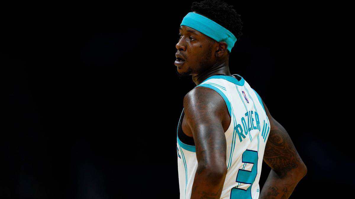 Charlotte Hornets guard Terry Rozier watches during the first half of a preseason NBA basketball game against the Memphis Grizzlies on Thursday, Oct. 7, 2021, in Charlotte, N.C. (AP Photo/Chris Carlson)