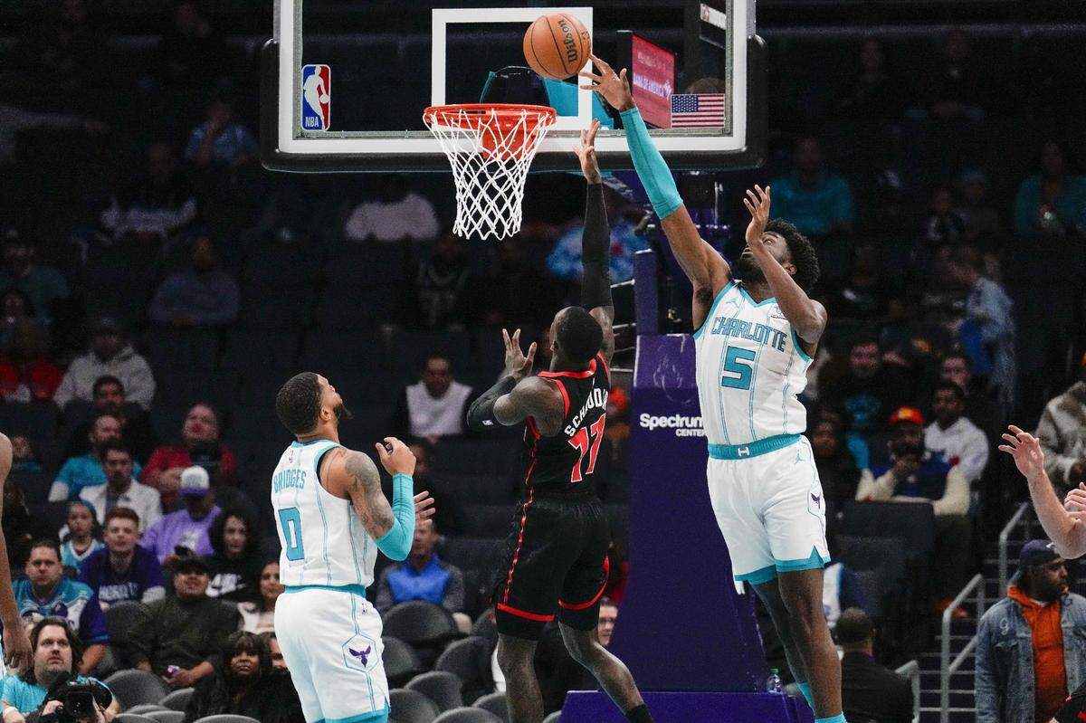 Charlotte Hornets center Mark Williams (5) blocks a shot by Toronto Raptors guard Dennis Schroder (17)  during the first quarter at the Spectrum Center. 