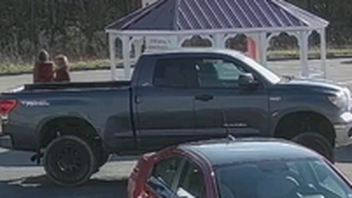 Police are looking for a woman they say grabbed $800 blowing around a North Carolina parking lot.