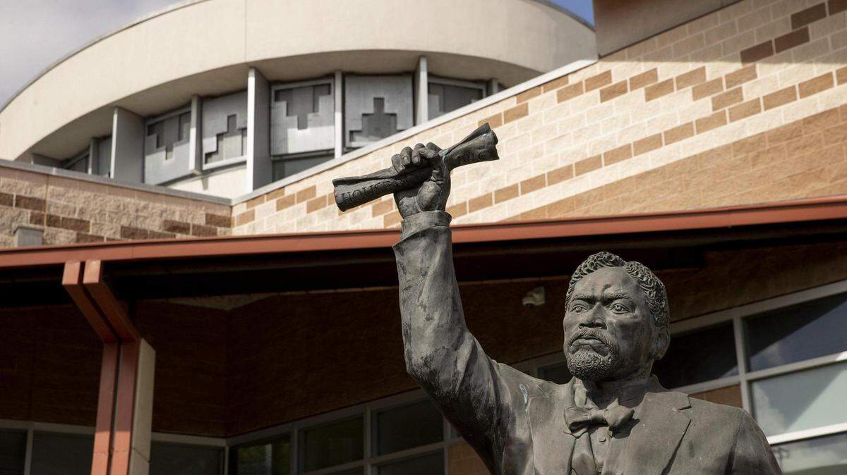 One the five bronze figures that make up the Juneteenth Memorial Sculpture Monument at the George Washington Carver Museum in Austin, Texas.