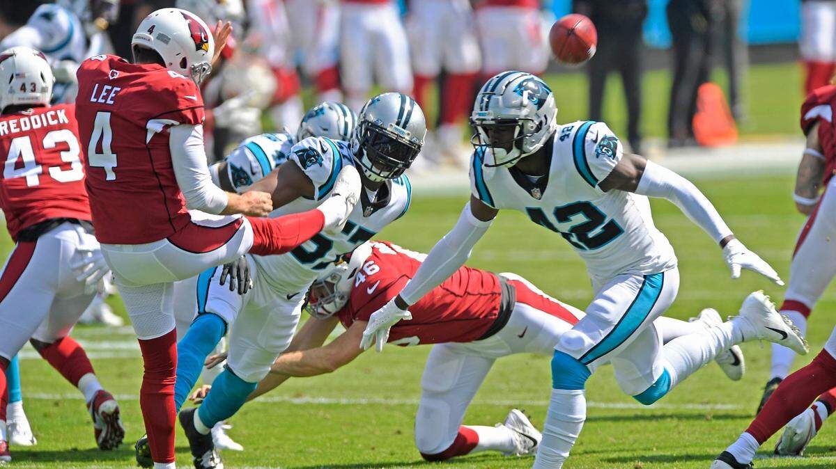 Carolina Panthers safety Sam Franklin (42) tips the punt of Arizona Cardinals punter Andy Lee (4) during the first half at Bank of America Stadium in Charlotte, NC on Sunday, October 4, 2020. The Panthers won, 31-21