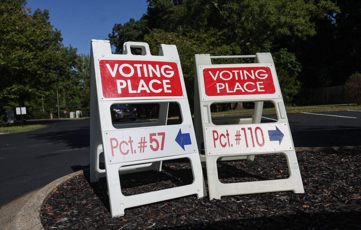 Signs for two precincts in one community direct voters to the correct area at Sharon Presbyterian Church in south Charlotte during the primary election in Charlotte on Tuesday, Sept. 9, 2025.