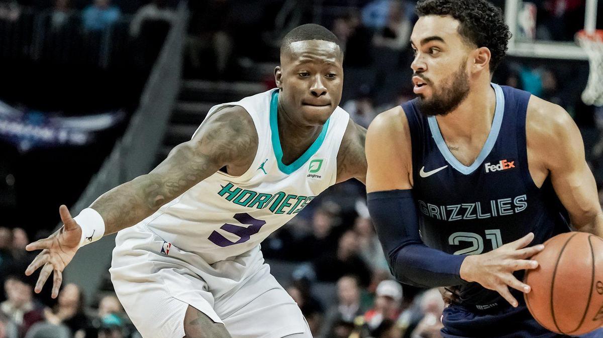 Hornet’s guard Terry Rozier (3) defends Grizzlie’s Tyus Jones (21).