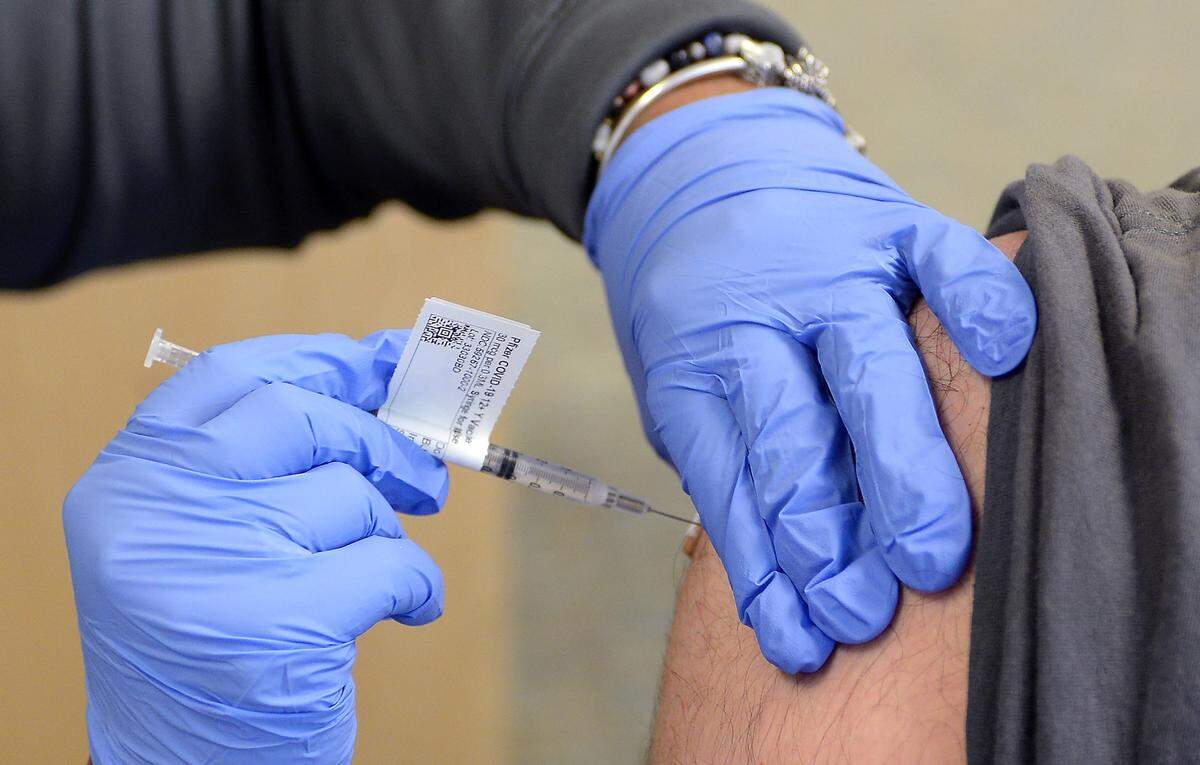 Timothy Garcia receives his first COVID vaccination.