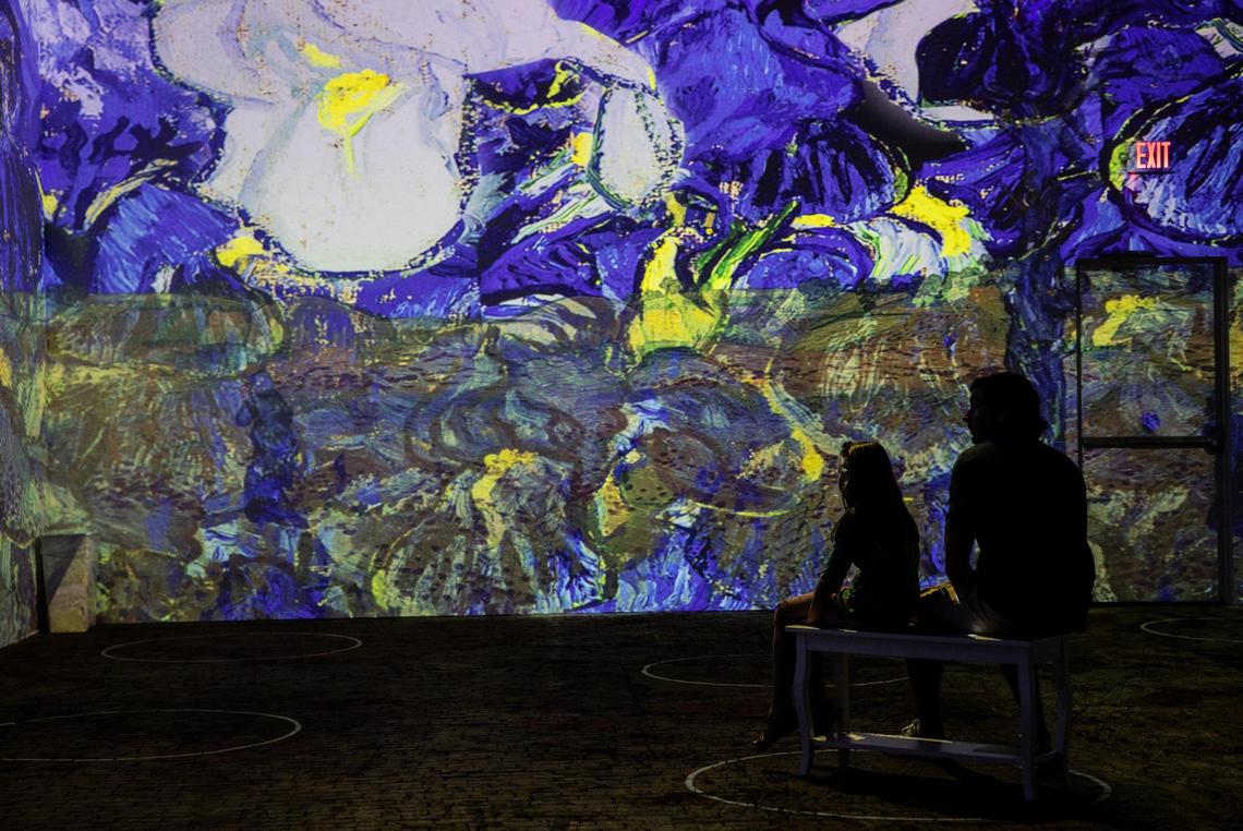 People watch the new Immersive Van Gogh Exhibit in Charlotte, N.C., on Thursday, June 17, 2021. Knikouyeh@charlotteobserver.com