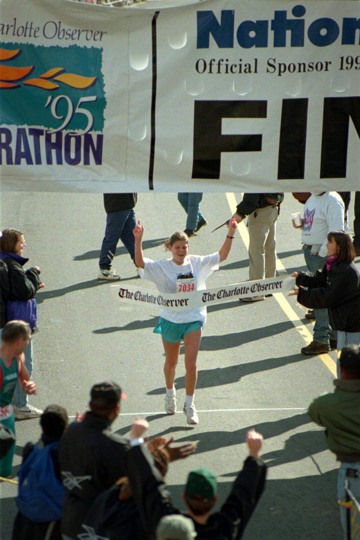 1/08/95 12H MARK B. SLUDER/Staff ALONE AT THE FINISH: Stephanie Shooks crosses the finish as champion, then sweats out some confusion before being officially declared marathon winner. [UNPUBLISHED:] (1/7/95) Women’s winner of the Charlotte ObserverMarathon, Stephanie Shook, celebrates as she crosses the finishline. MARK B. SLUDER / STAFF