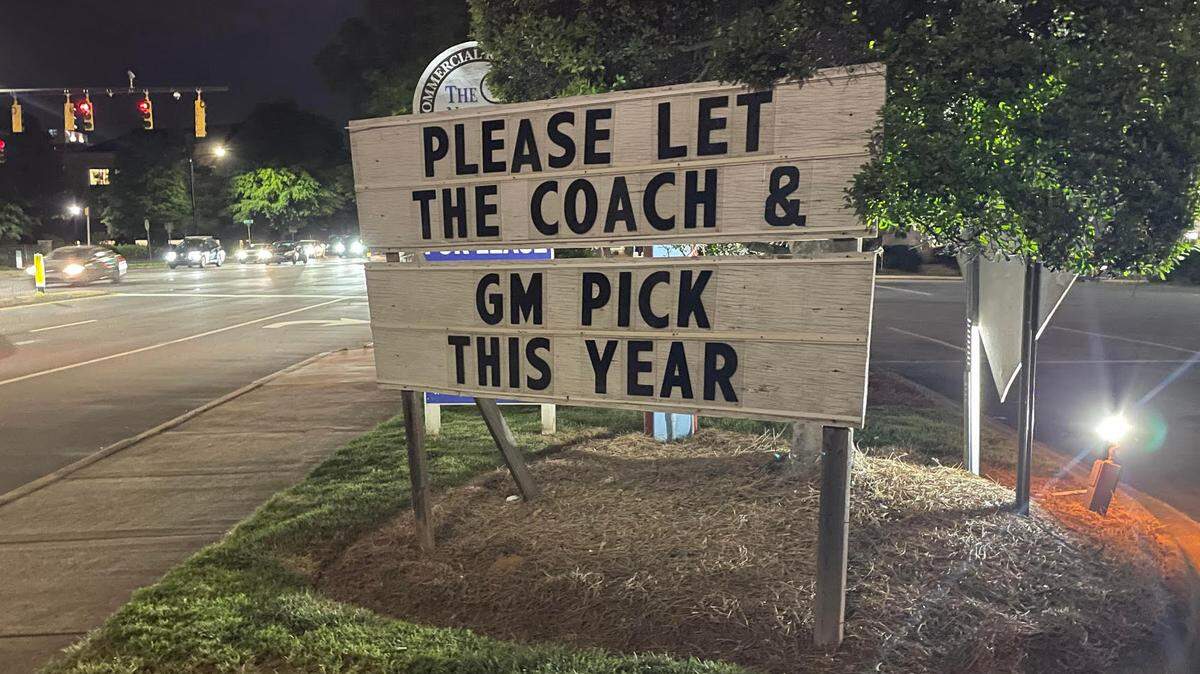 This sign, directed at Carolina Panthers owner David Tepper and regarding this week’s NFL Draft, sits outside Dilworth Neighborhood Grille in Charlotte.