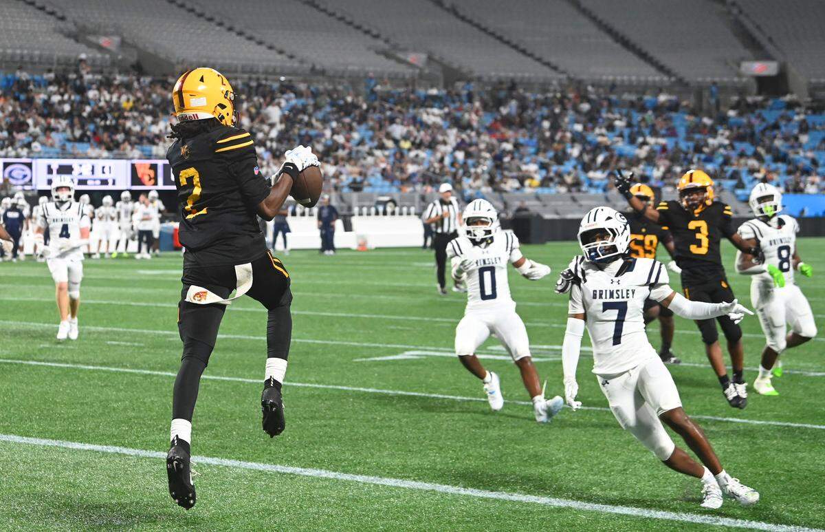 West Charlotte Lions wide receiver Donte Nicholson catches a touchdown pass against the Grimsely Whirlies during the Keep Pounding Classic at Bank of America Stadium on Friday, August 22, 2025.