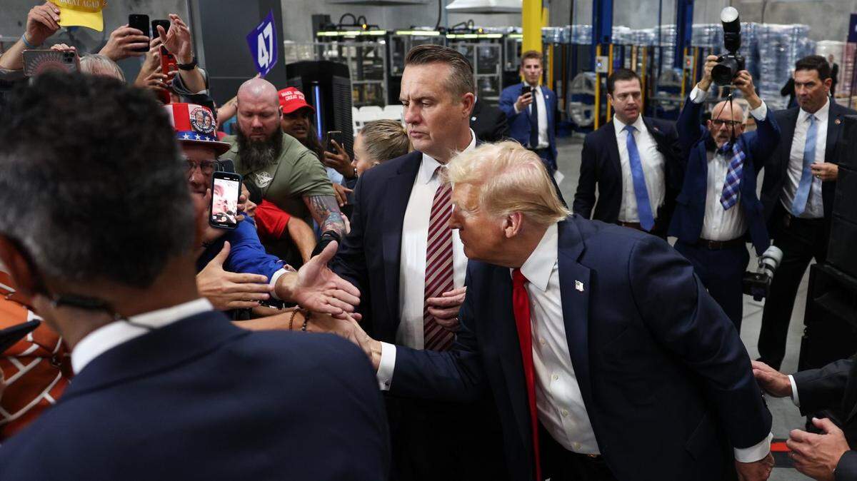 Then-candidate Donald Trump shakes hands with supporters a campaign rally inside the Mosack Group manufacturing warehouse in Mint Hill, NC on Wednesday, September 25, 2024.
