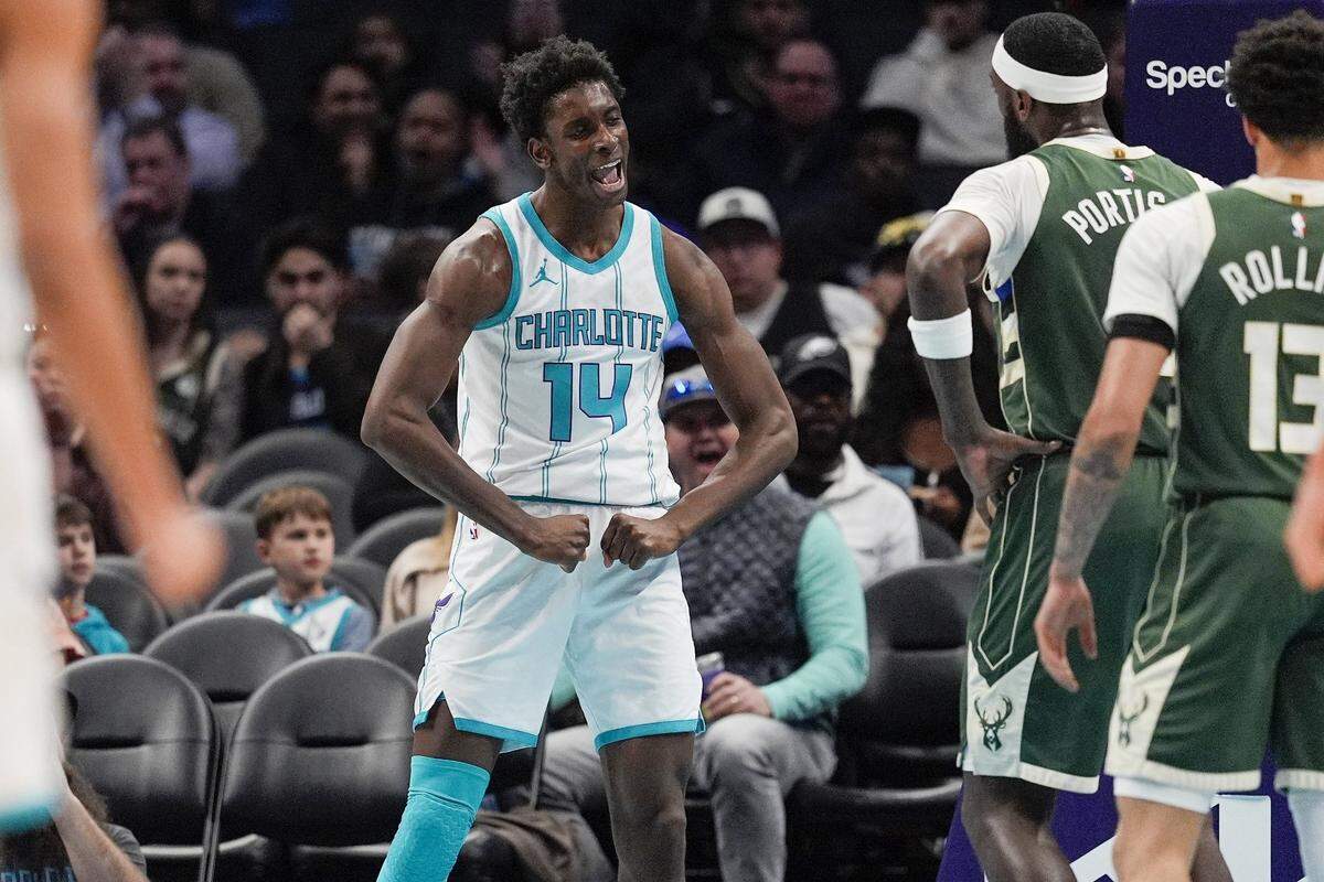 Charlotte Hornets forward Moussa Diabate (14) reacts to his three point play against the Milwaukee Bucks during the second quarter at Spectrum Center.