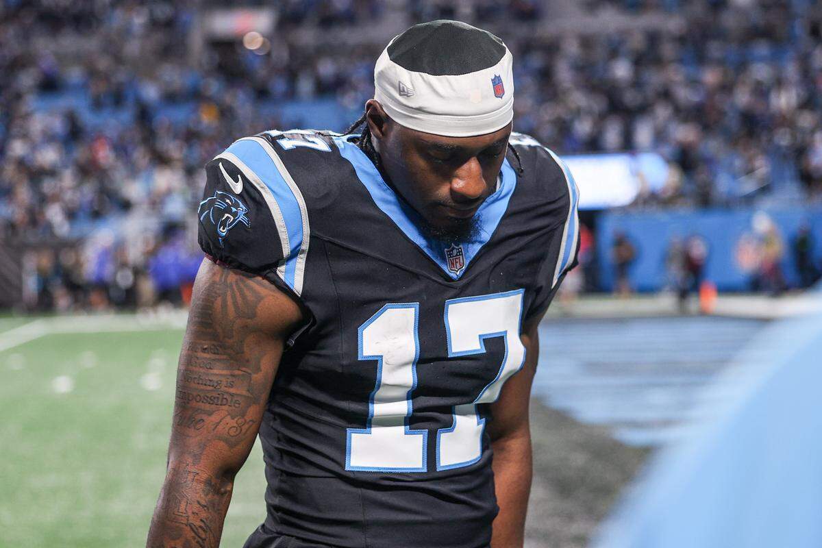 Panthers wide receiver Xavier Legette hangs his head as he walks off the field after a loss to the Rams, 34-31, in the wild-card playoff game on Jan. 10, 2026, at Bank of America Stadium.