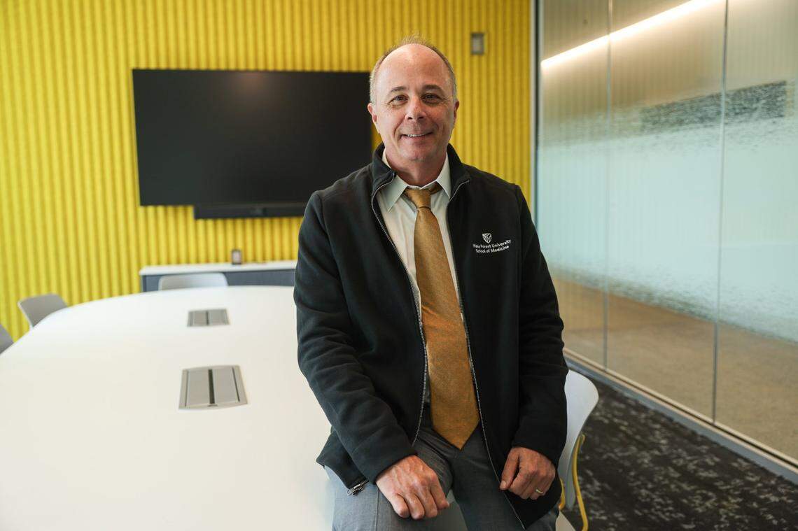 Dr. Chris Burns, a faculty development specialist at the new medical school, in one of the small group rooms for problem-based learning. The school also has simulated patient care rooms with community members acting as patients. Students will work there as if they were at a real hospital or primary care office, Burns said.