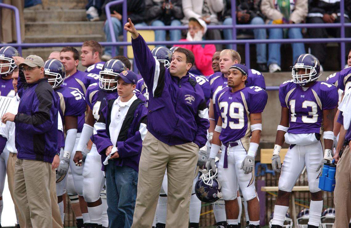 Panthers coach Matt Rhule, hand raised, and Georgia Tech coach Geoff Collins, left, were assistants together at WCU, as seen here in 2002. (Courtesy of WCU)
