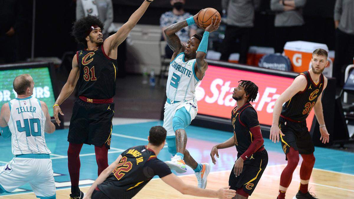 Charlotte Hornets guard Terry Rozier, center, drives into the lane looking to pass to a teammate during first half action against the Cleveland Cavaliers at Spectrum Center in Charlotte, NC on Wednesday, April 14, 2021.