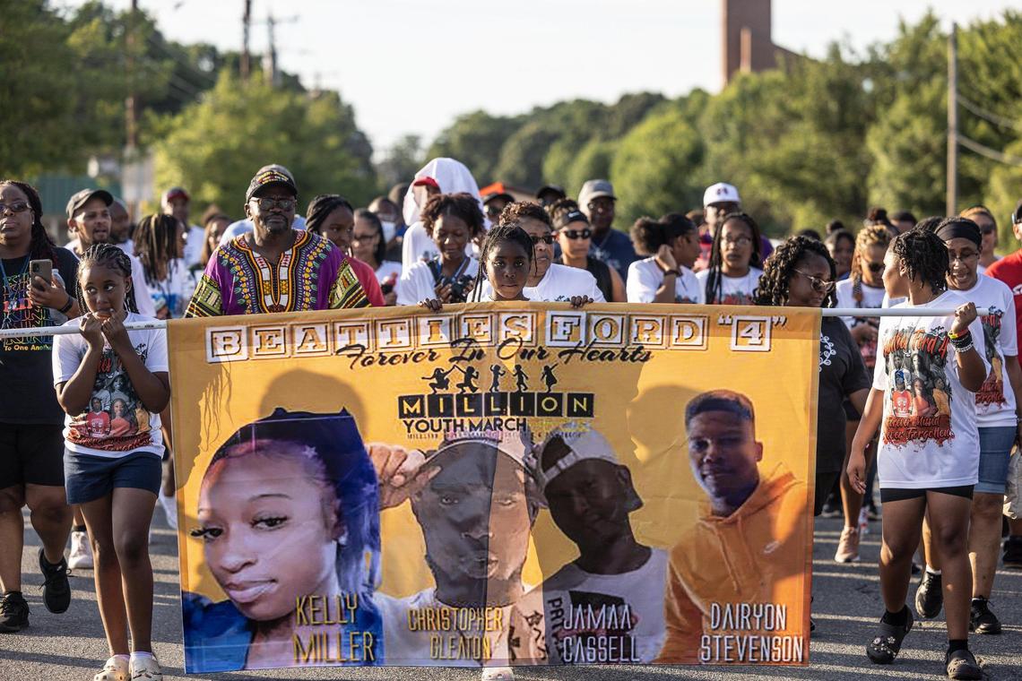 Community members gathered to pray at Friendship Missionary Baptist Church in west Charlotte before marching down Beatties Ford Road to a recently unveiled memorial to Christopher Gleaton, Dairyon Stevenson, Jamaa Cassell, and Kelly Miller on Wednesday, June 22. The four were killed in a mass shooting during a Juneteeth block party in 2020.