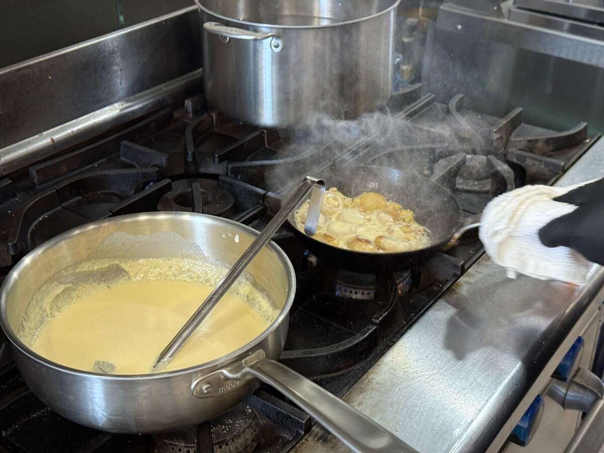 Chef Chris Rogienski shows off a technique that went through multiple iterations before ending up with Leluia Hall’s final version of masa and cheese.