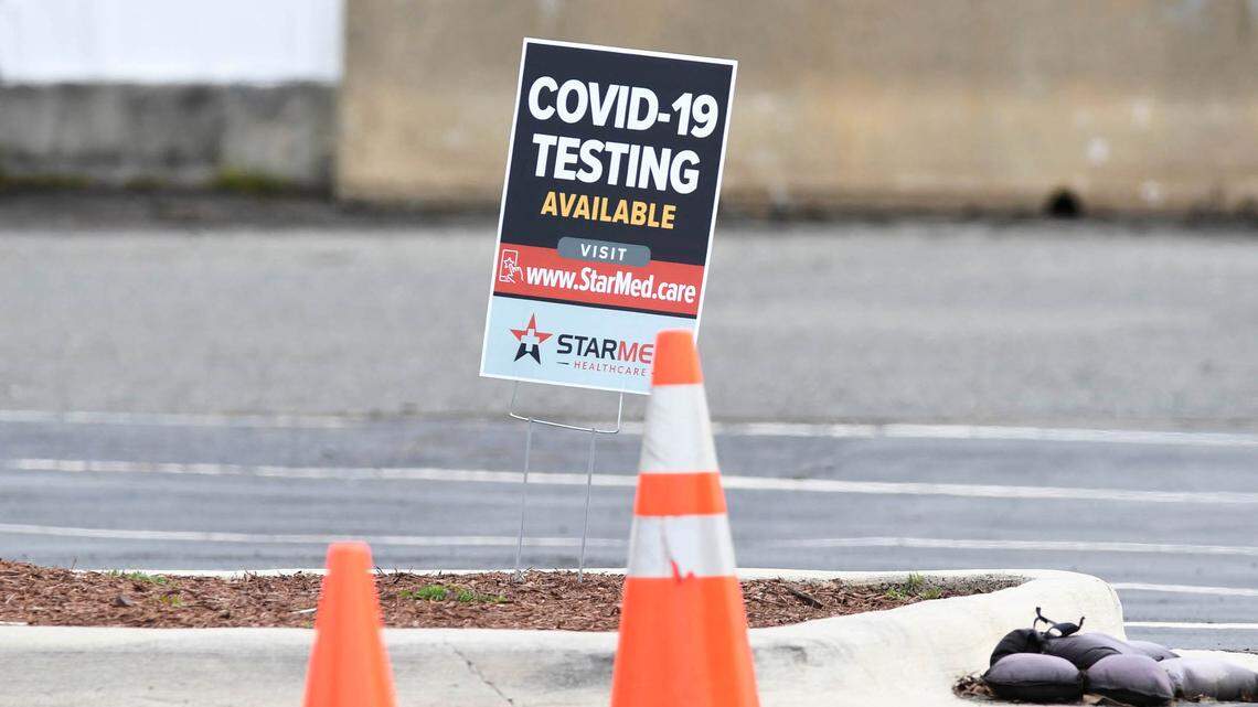 A sign advertising drive-thru COVID-19 testing at StarMed Family & Urgent Care on Feb. 4, 2021. Officials are warning consumers about COVID-19 testing scams.