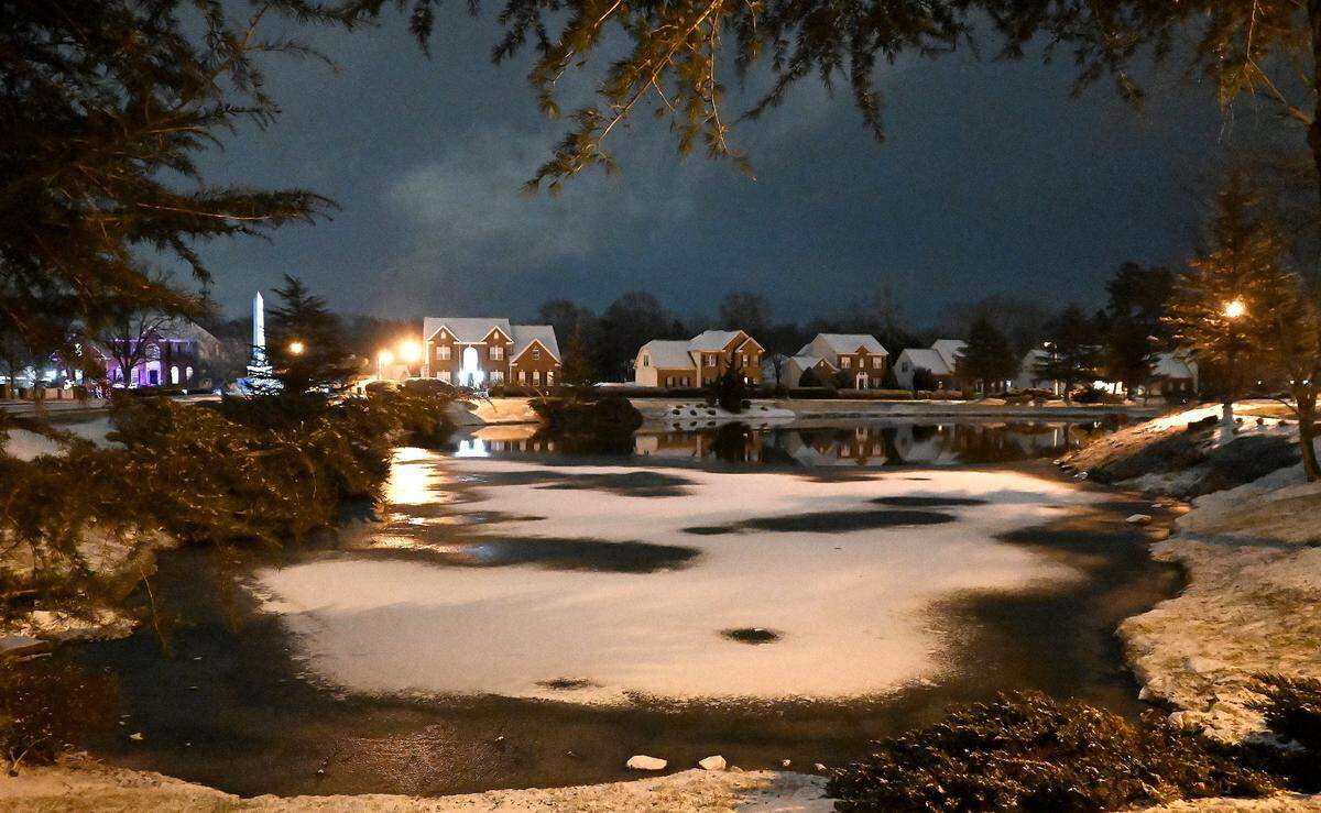 A dusting of snow covers the roof tops of homes and a portion of a pond in the Village of Lake Park in Union County on Tuesday, January 21. The county is one of the Charlotte area’s fast-growing suburban areas.